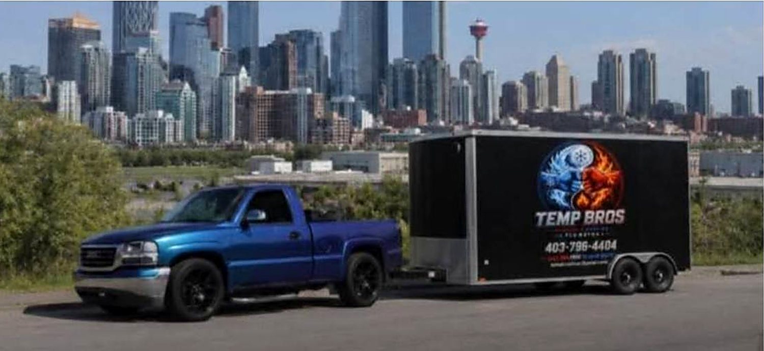 The Temp Bros truck and trailer with the Calgary skyline behind